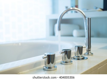 Bathtub Faucet With Running Water,shallow Focus.
