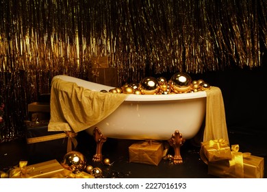 Bathtub full of golden balls. Vintage bright bathroom decorated with festive golden balls. New Year, Christmas bathroom interior. - Shutterstock ID 2227016193