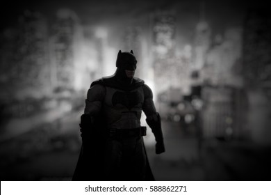 Batman DC Multiverse Series action figure standing in front of a Gotham City backdrop