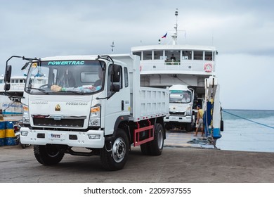 Bato, Leyte - Sept 2022: An Open Bed Truck Is Being Loaded In Reverse Onto A Roro Ship. Roll-on Roll-off Vessel Operations.