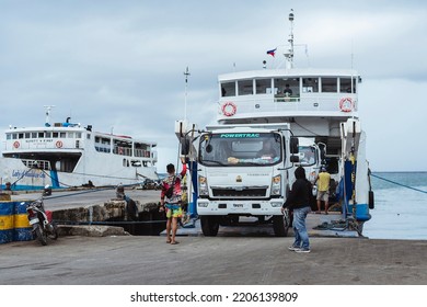 Bato, Leyte - Sept 2022: An Open Bed Truck Is Being Loaded In Reverse Onto A Roro Ship. Roll-on Roll-off Vessel Operations.