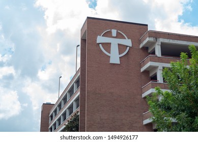 BATON ROUGE, L.A. / USA - AUGUST 08, 2019: Our Lady Of The Lake Regional Medical Center, The Hospital's Branded Logo On The Exterior Brick Wall Above The ER Entrance.