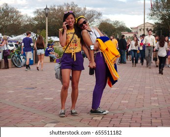 BATON ROUGE, LOUISIANA - 2014: Fans Hold Hands And Smile At Louisiana State University During An LSU Football Game.