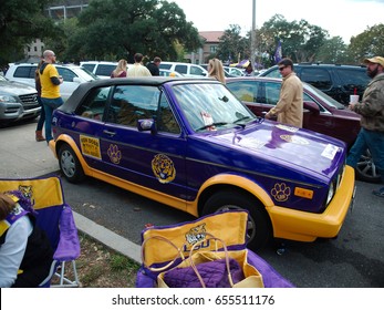 BATON ROUGE, LOUISIANA - 2014: A Volkswagen Golf Painted With The LSU Tigers Colors, Purple And Gold, Is Seen At A Parking Lot At Louisiana State University During A Football Game.