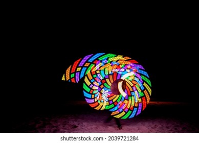 A Baton Show Made Of Colorful LED Lights With Beautiful Patterns That Change As The Lights Twirling.