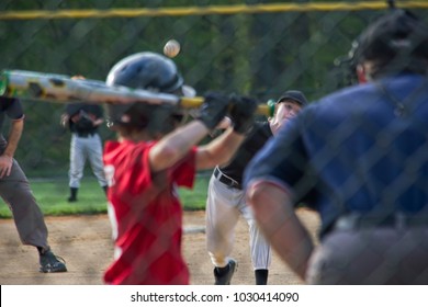 Batter Watching Pitch In Youth Baseball