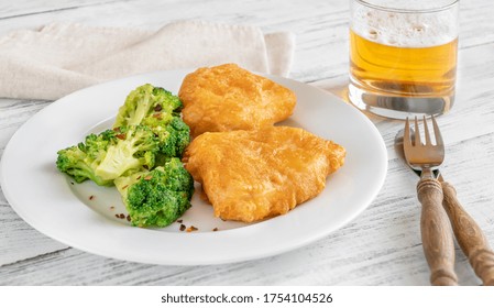 Battered Fish With Steamed Broccoli And Glass Of Beer