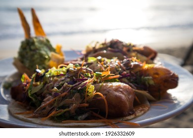 Battered Fish Tacos Topped With Slaw And Salsa, Served With Guacamole At A Restaurant On The Beach Of Bucerias, Mexico