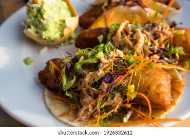 Battered Fish Tacos Topped With Slaw And Salsa, Served With Guacamole At A Restaurant On The Beach Of Bucerias, Mexico