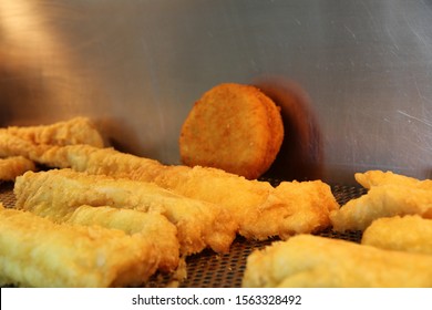 Battered sausage with fish cakes in a chip shop