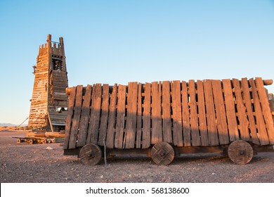 Battering Ram And Siege Tower In A Desert At Evening