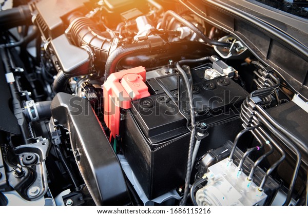 battery car engine detail motor / close up\
of machine new batteries car engine checking car battery cleaning\
for deliver customers in the car service\

