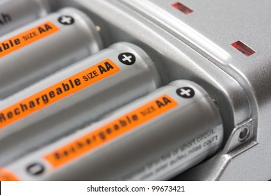 Battery charger with batteries AA background