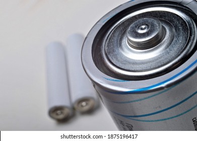 Battery group of different types and sizes on a white background