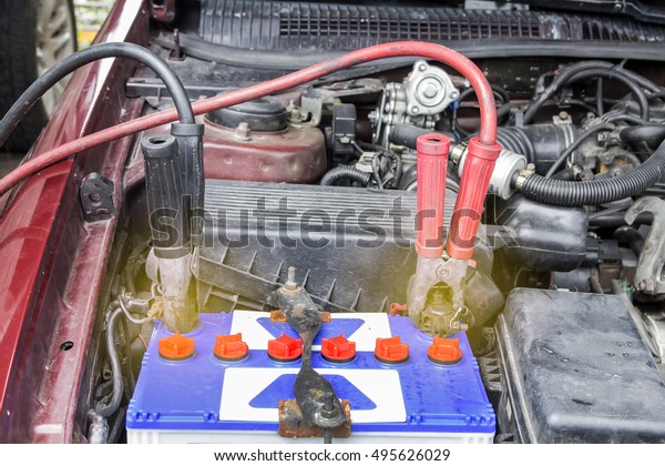 The battery jumper chargers with of\
battery is worn because the user for a long time. A car mechanic\
battery charger uses jumper cable with to start\
engine.