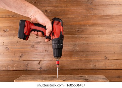 Battery screwdriver to screw on wood - Powered by Shutterstock