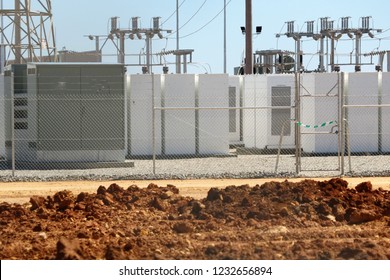 Battery Storage At Solar Farm With Switchgear Or Switch Gear In Background.