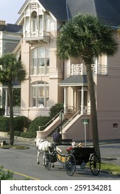 Battery Street And Walkway With Carriage And Historic Waterfront Home In Charleston, SC