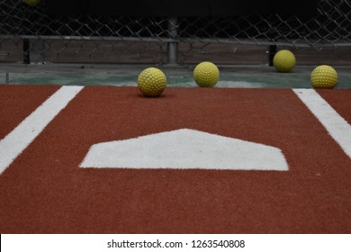 Batting Cage Home Plate And Softballs