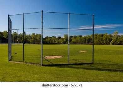 A Batting Cage At A Small Park