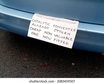 Battle, East Sussex UK, 11-27-21 Sign On Vehicle Warning Potential Criminals That The Catalytic Converter Has Already Been Stolen And A Cheaper Part Substituted