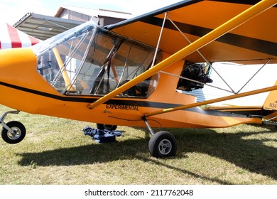 BATTLE LAKE, MINNESOTA USA - AUGUST 31, 2019: Orange Experimental Ultralight Airplane Displayed At The 