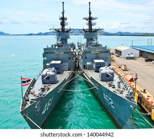 Battleship Docked At The Harbor. Bow With Anchor And Thailand Flag