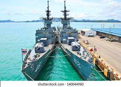 Battleship Docked At The Harbor. Bow With Anchor And Thailand Flag