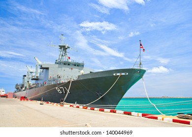 Battleship Docked At The Harbor. Bow With Anchor And Thailand Flag