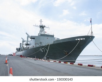 Battleship Docked At The Harbor. Bow With Anchor