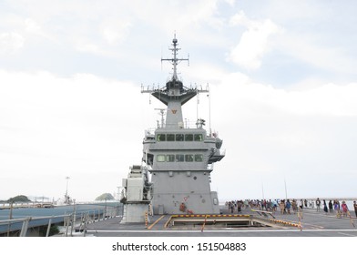 Battleship Docked At The Harbor. Bow With Anchor