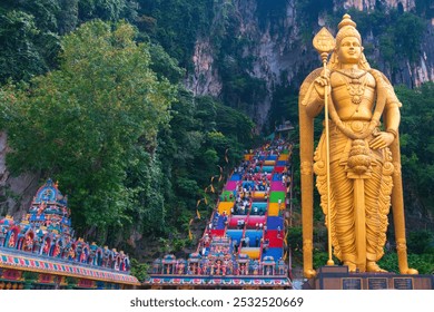 Batu Caves, Kuala Lumpur, July 21, 2023: New view with colourful staircase at Murugan Temple Batu Caves has become a new tourist attraction in Malaysia. This was on a hot, humid, afternoon in Malaysia