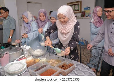 Batu Pahat , Malaysia - May 3rd, 2022 : A Family Hari Raya Aidilfitri Eid-Ul-Fitr Meal and Celebration in Malaysia .Family, Happiness and Forgiveness Concept.
