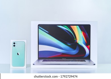 Batumi, Georgia. 27 July 2020 - Boxes of mint green iPhone 11 with dual camera and 16 inch MacBook Pro of 2019 release. Apple gadgets
