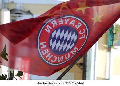BATUMI, GEORGIA - Jul 17, 2017: A Shallow Focus Shot Of The FC Bayern Munich Flag With Its Logo On A Blurry Background