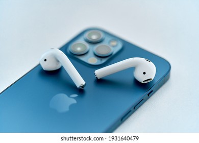 Batumi, Georgia - March 2, 2021 - Airpods 2 and Iphone 12 Pro Max. Smart modern newest Apple gadgets 