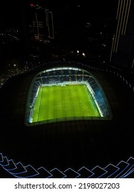 Batumi, Georgia - May 8 2022: Picture From A Drone Of The New Stadium In Batumi. Night View From A Drone On A Football Field With Players During A Match. Vertical Photo