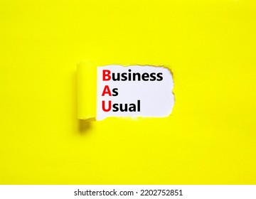 BAU business as usual symbol. Concept words BAU business as usual on white paper on a beautiful yellow background. Business and BAU business as usual concept. Copy space. - Shutterstock ID 2202752851