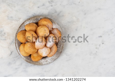 Baursak - traditional Kazakh (Asia) food \ national bread in plate on marble
 background, top view
