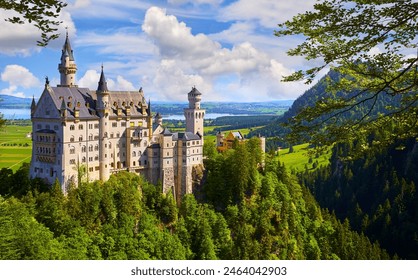 Bavaria, Germany. Fairytale Neuschwanstein Castle in Bavarian Alps mountains. Picturesque view at green forest trees, lake sunrise sky with clouds. Famous neuschwanstein landmark travel destination - Powered by Shutterstock