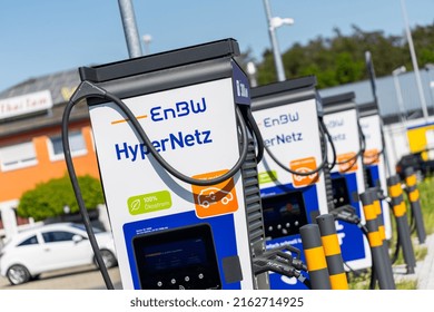 Bavaria, Germany, March 2022: EnBW Supercharger for electric cars, battery charging station. EnBW Superchargers, part of a serie of a expanding car charging network in germany.