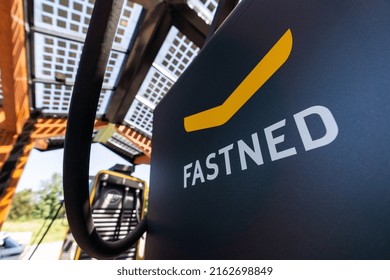 Bavaria, Germany, March 2022: Fastned Logo on a Supercharger of a electric car, battery charging station. Supercharger Fastned, part of a serie of a expanding car charging network in germany.