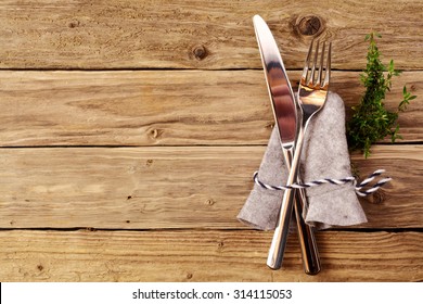 Bavarian cutlery on wooden table with copyspace for oktoberfest or other german festivals