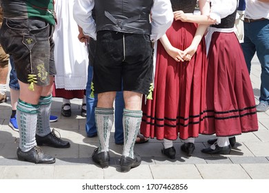 Bavarian Dress (dindl And Lederhosen) And Traditional Dancing