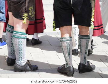 Bavarian Dress (dindl And Lederhosen) And Traditional Dancing