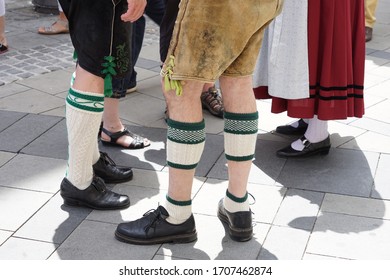 Bavarian Dress (dindl And Lederhosen) And Traditional Dancing