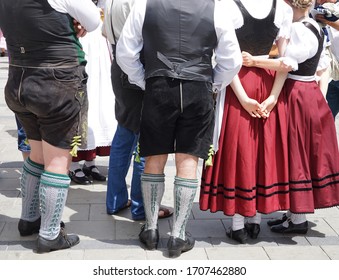 Bavarian Dress (dindl And Lederhosen) And Traditional Dancing