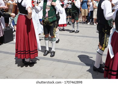 Bavarian Dress (dindl And Lederhosen) And Traditional Dancing