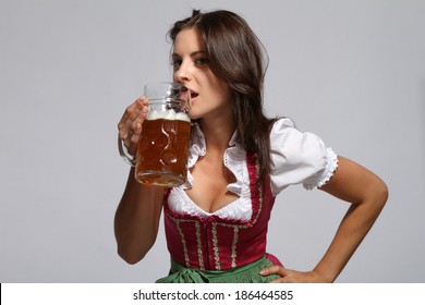 Bavarian Girl Is Drinking Beer 