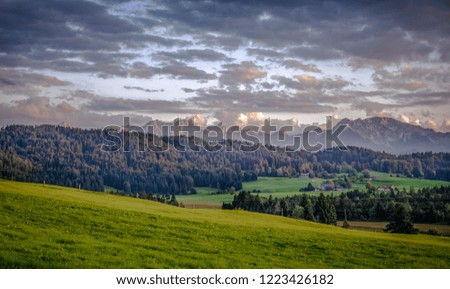 Similar – Image, Stock Photo Inspiring evening light in spring. Sunset in Mountains